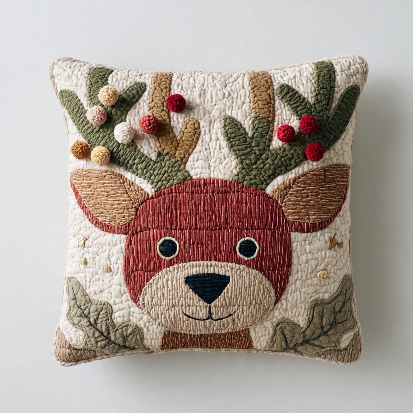 Red-Toned Reindeer Quilted Pillow — Pom Garland Antlers, Playful Holiday Accent